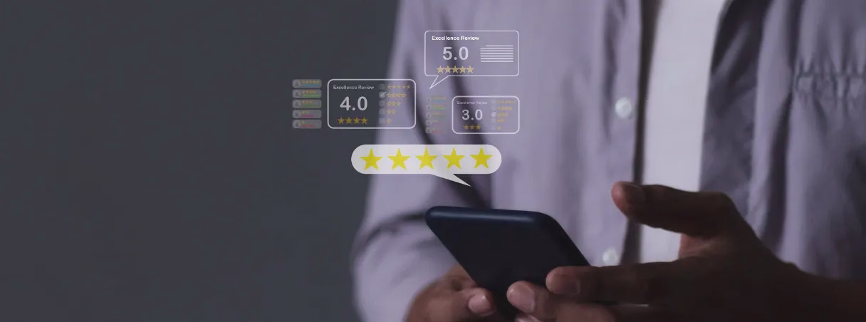 Person holding a smartphone with star ratings and scores floating above the screen, representing online reputation.